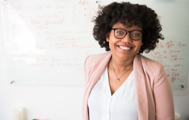 Photo of woman with glasses smiling